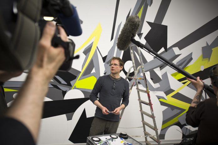 Mirko Reisser (DAIM), "DAIM - up and around", taping on wall, 1050 x 405 cm, 2011 | part | Exibition: "Street-Art - meanwhile in deepest east anglia thunderbirds were go..." | Von der Heydt Kunsthalle Barmen, Wuppertal / Germany | 2011 | making of